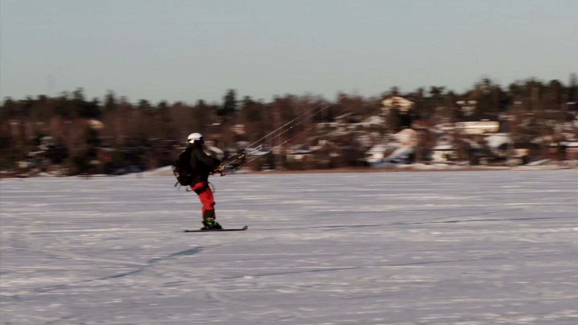 24. Åker skidor med fallskärm